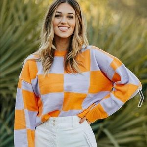 la lavon checkered orange and lilac sweater